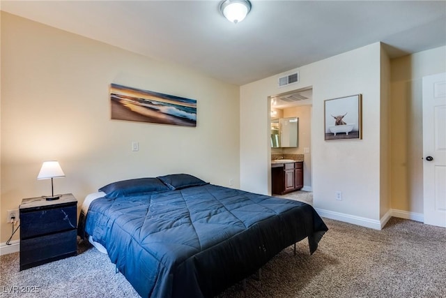 bedroom featuring carpet floors, ensuite bath, visible vents, and baseboards