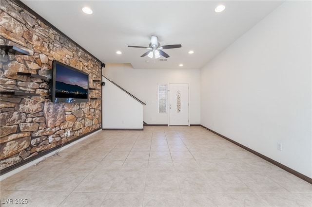 unfurnished living room featuring recessed lighting, ceiling fan, baseboards, and tile patterned floors