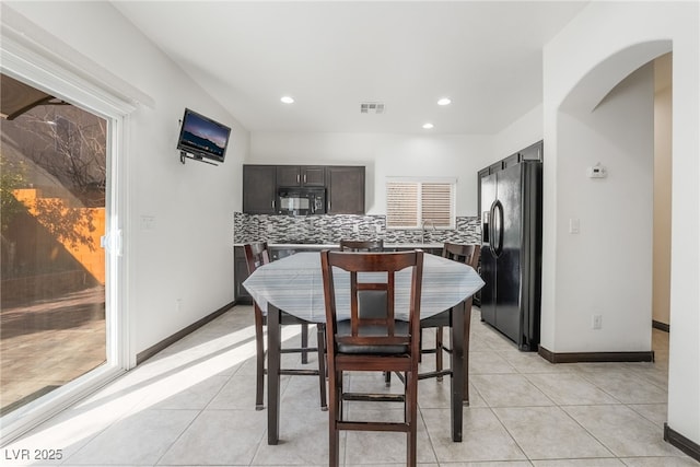 dining space with light tile patterned floors, baseboards, visible vents, and recessed lighting