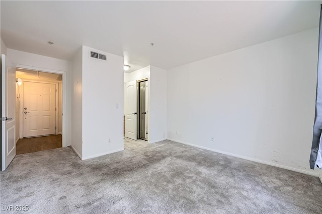 unfurnished bedroom featuring carpet, visible vents, and baseboards