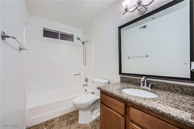 bathroom featuring washtub / shower combination, vanity, and toilet