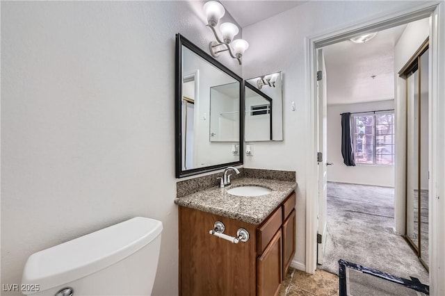 half bath with vanity and toilet