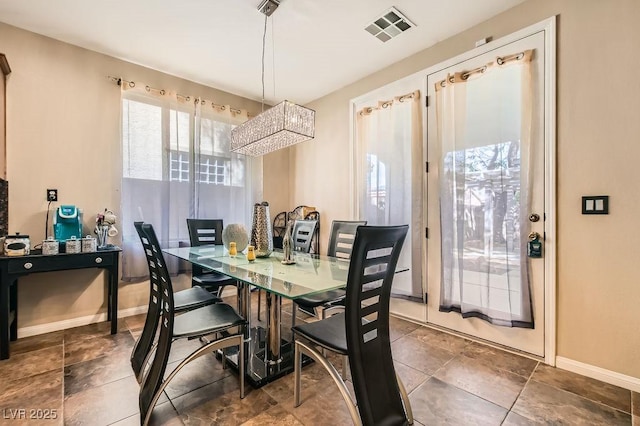 dining area with visible vents and baseboards