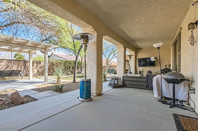 view of patio featuring a grill, a pergola, an outdoor hangout area, and fence