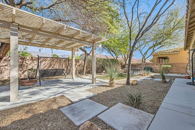 view of yard featuring a patio, a fenced backyard, and a pergola