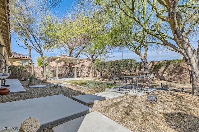 view of yard with a fenced backyard, a pergola, and a patio