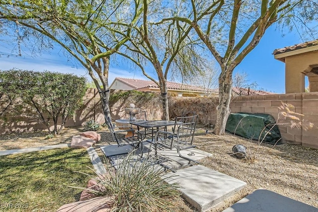 view of yard featuring a patio area and a fenced backyard