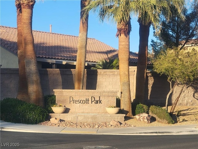 community sign with fence