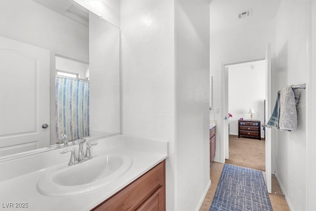 full bathroom featuring visible vents and vanity