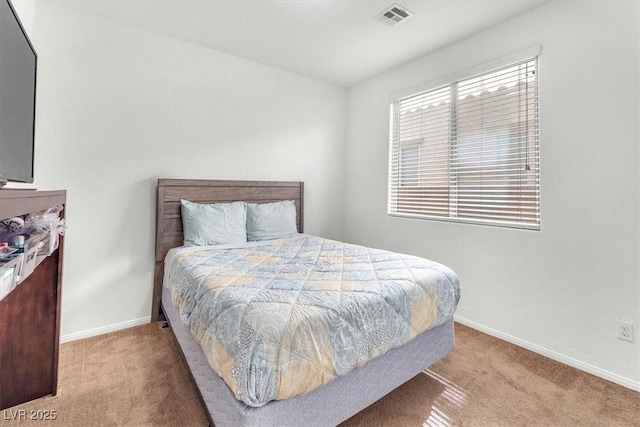 bedroom with baseboards, visible vents, and carpet flooring