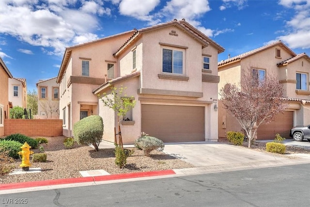 mediterranean / spanish-style house featuring an attached garage, a tiled roof, concrete driveway, and stucco siding