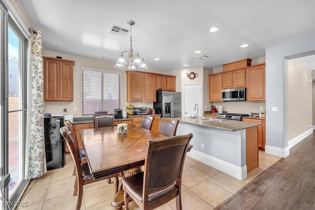 dining room with recessed lighting, visible vents, an inviting chandelier, light tile patterned flooring, and baseboards