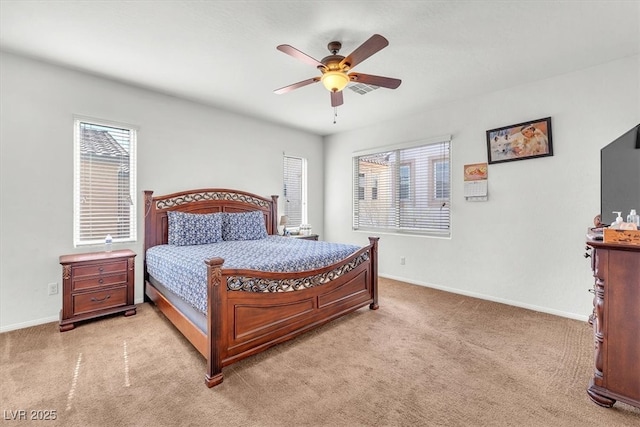 bedroom featuring a ceiling fan, light colored carpet, visible vents, and baseboards