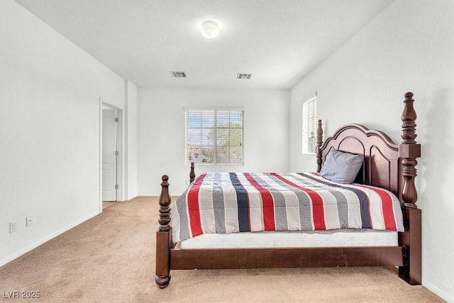 bedroom with carpet, visible vents, and baseboards