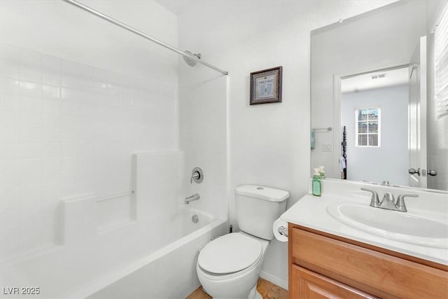 bathroom featuring toilet, shower / bathtub combination, and vanity