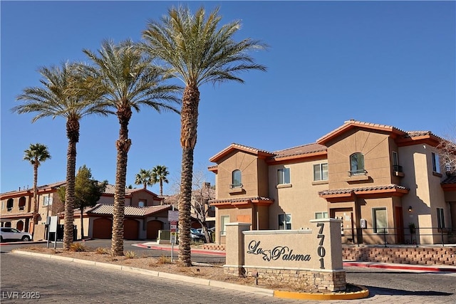 view of property with driveway