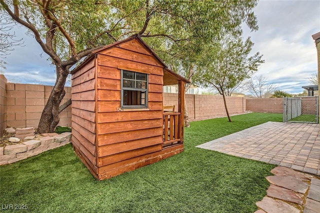 view of shed with a fenced backyard