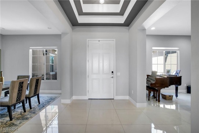 foyer with recessed lighting, baseboards, and tile patterned floors