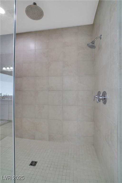 full bathroom with a tile shower