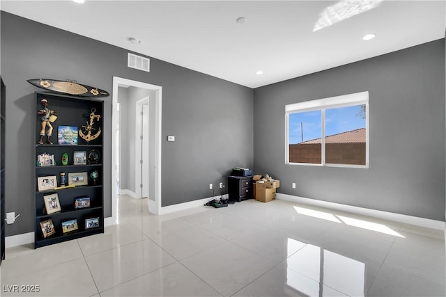 unfurnished room featuring tile patterned flooring, visible vents, baseboards, and recessed lighting