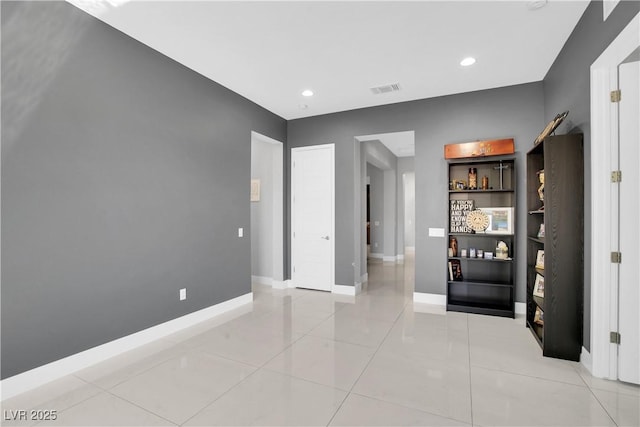 unfurnished bedroom with light tile patterned flooring, recessed lighting, visible vents, and baseboards