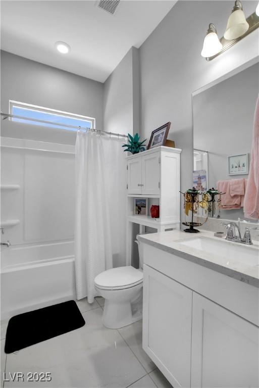 bathroom with shower / tub combo, vanity, and toilet