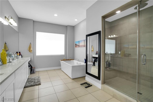 bathroom featuring double vanity, a soaking tub, a shower stall, and tile patterned flooring