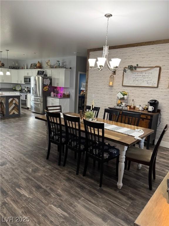 dining space with a notable chandelier and dark wood-type flooring