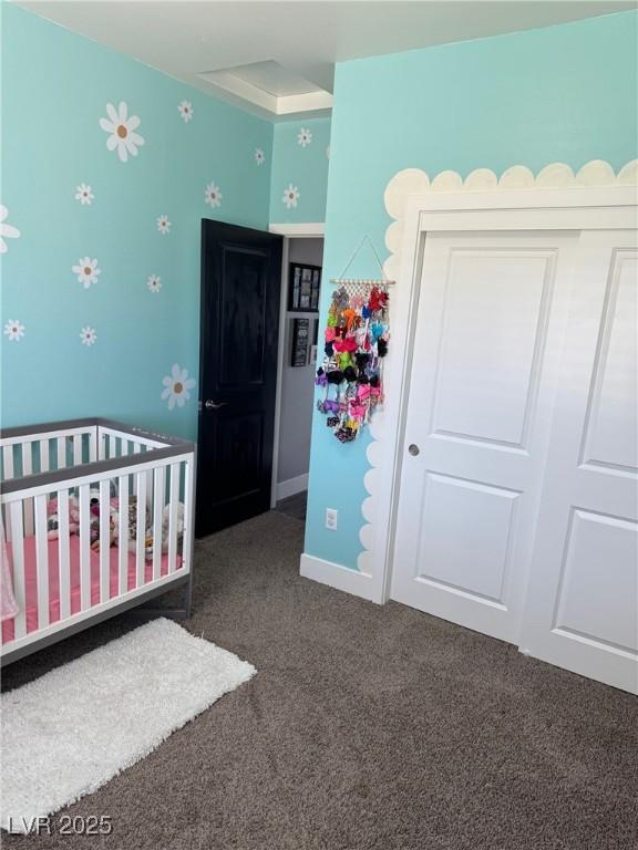 bedroom with carpet floors and baseboards