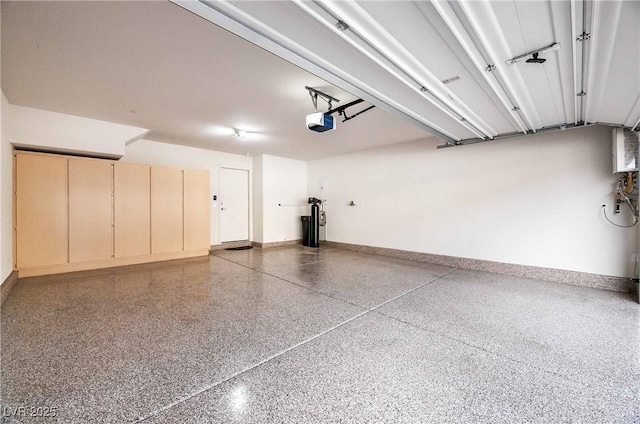 garage featuring baseboards and a garage door opener