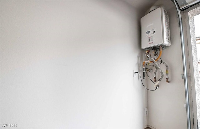 utility room with tankless water heater