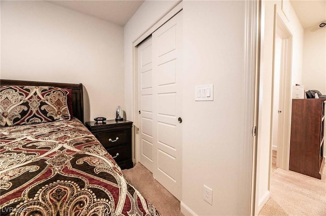 bedroom featuring light carpet