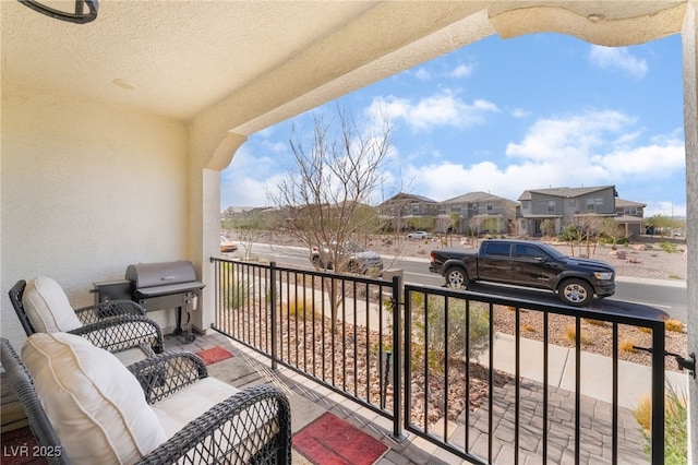 balcony with a residential view and grilling area