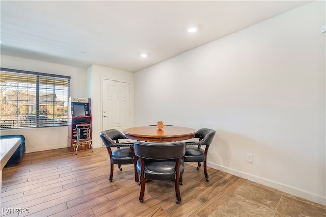 dining area featuring recessed lighting, wood finished floors, and baseboards