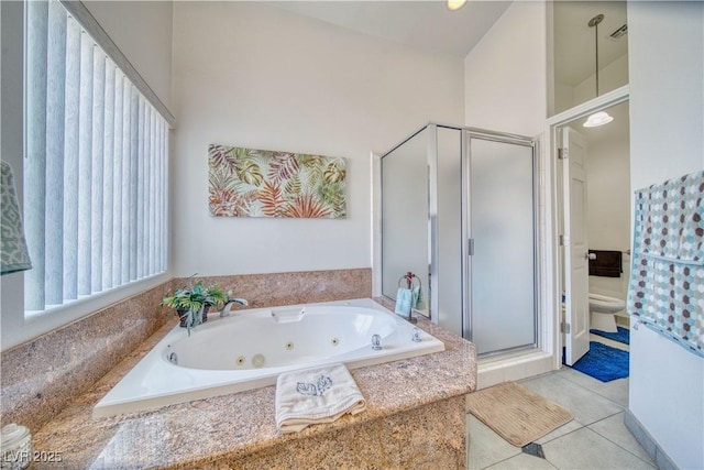 full bath featuring a shower stall, toilet, a tub with jets, and tile patterned floors