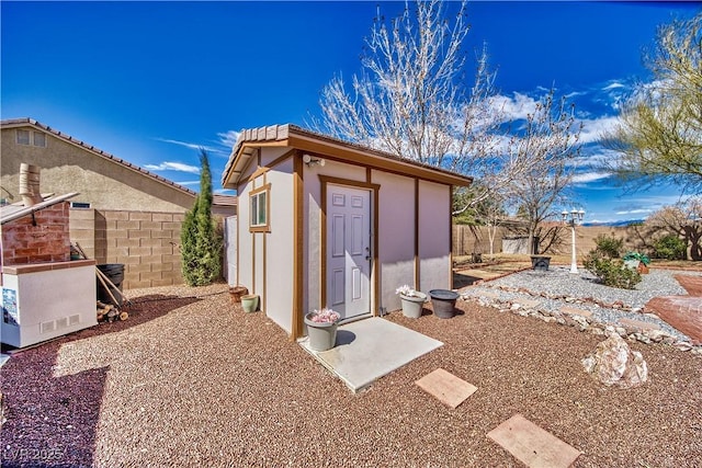 view of shed featuring a fenced backyard