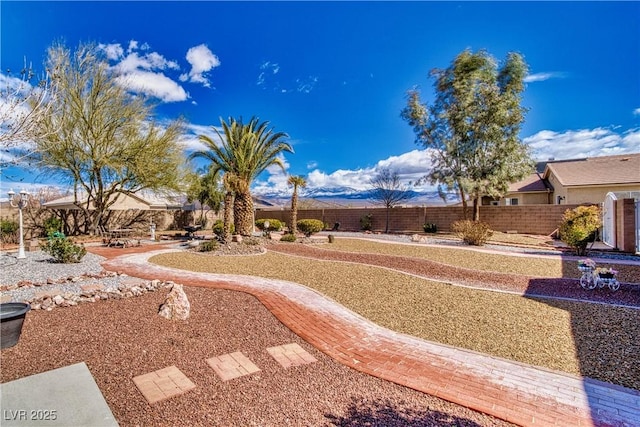 view of yard featuring a patio and fence