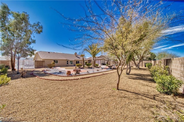 view of yard featuring a patio and a fenced backyard