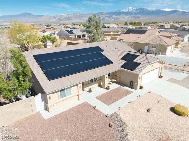 drone / aerial view with a mountain view and a residential view