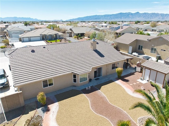 birds eye view of property with a residential view and a mountain view