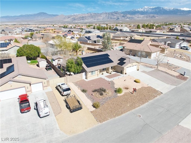 birds eye view of property featuring a mountain view and a residential view