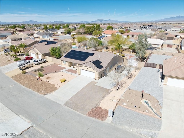 bird's eye view featuring a mountain view and a residential view