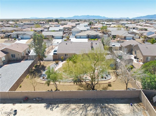 drone / aerial view with a mountain view and a residential view