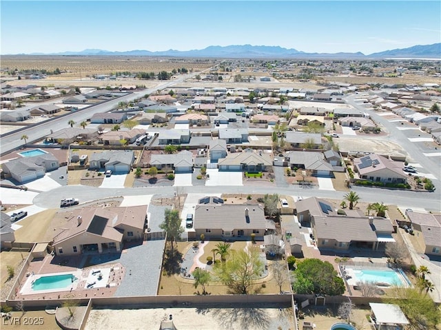 birds eye view of property featuring a mountain view and a residential view