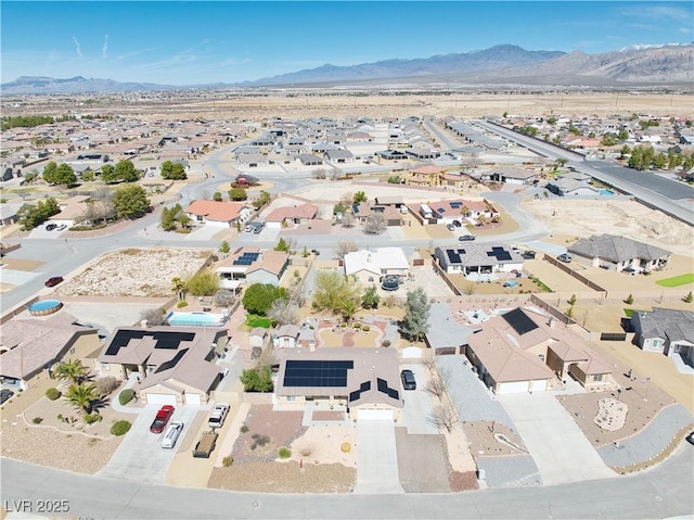 birds eye view of property featuring a mountain view and a residential view