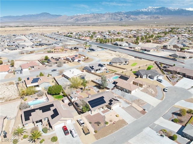 drone / aerial view featuring a mountain view and a residential view