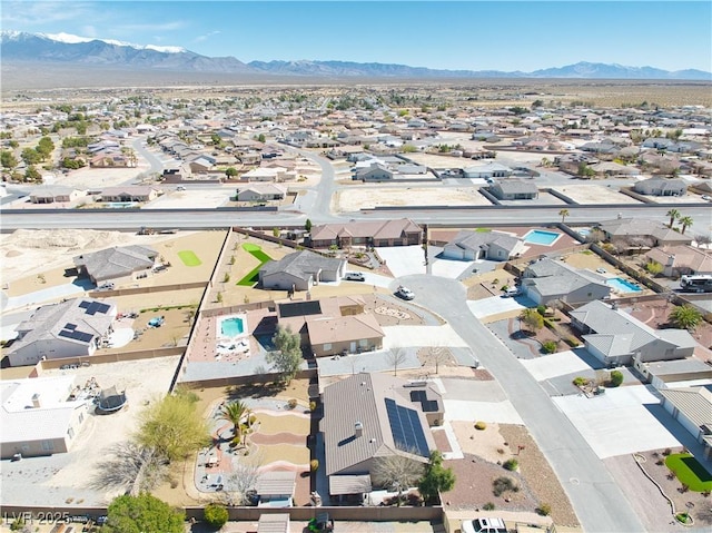 birds eye view of property featuring a mountain view and a residential view