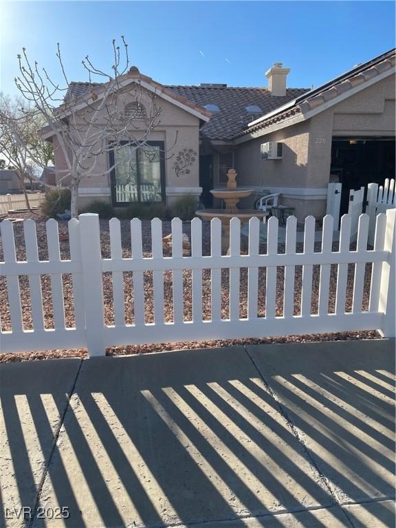 view of gate featuring a fenced front yard