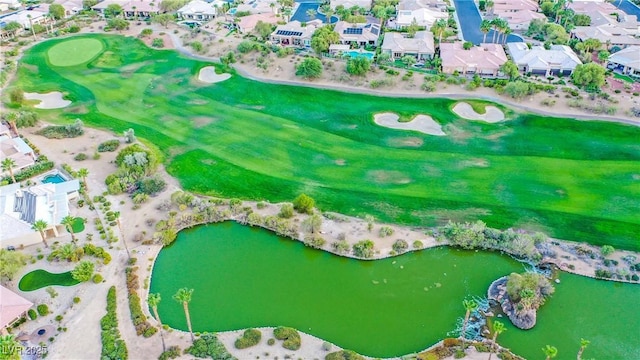 birds eye view of property with a water view and a residential view