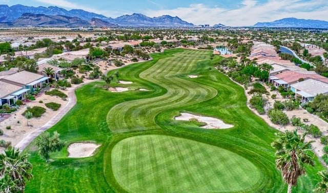 aerial view featuring a mountain view and golf course view